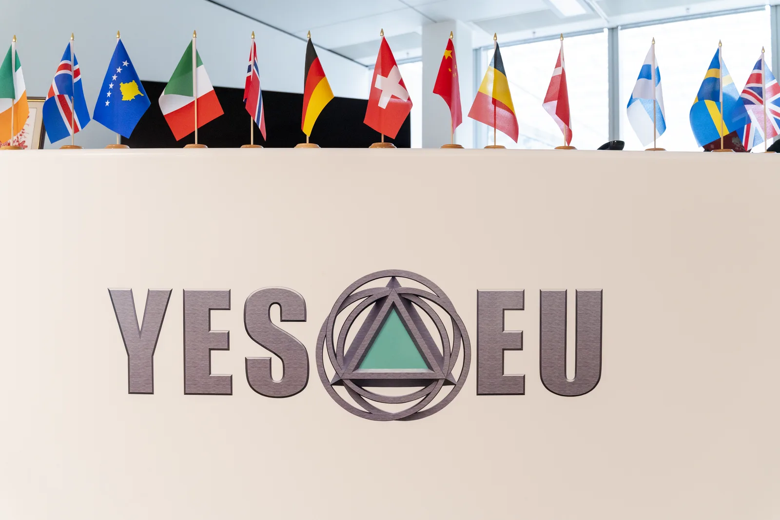 YES-EU reception with the company mark and European national flags at the Frankfurt office